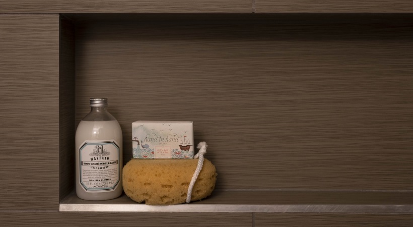 a shelf with soap, soap and a bottle of shampoo at The Ash at  Branch