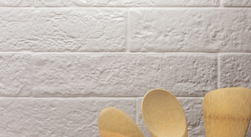 a wooden spoon and wooden spoon on a white brick wall at The Ash at  Branch