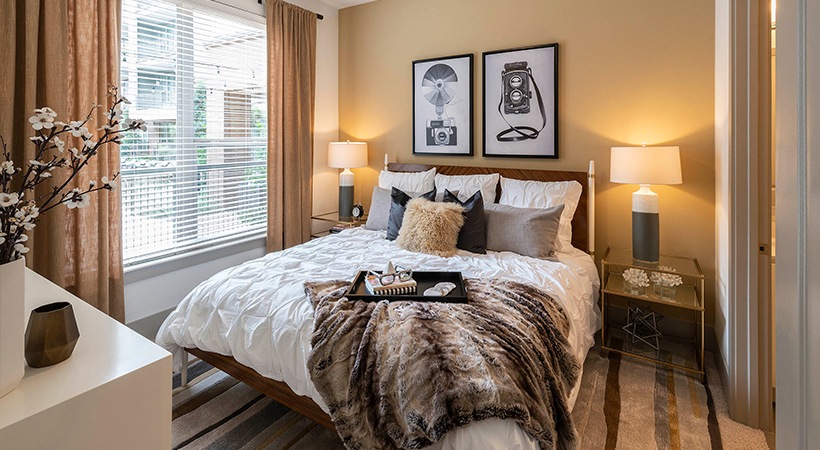 a bedroom with a bed, nightstands and a lamp at The Ash at  Branch