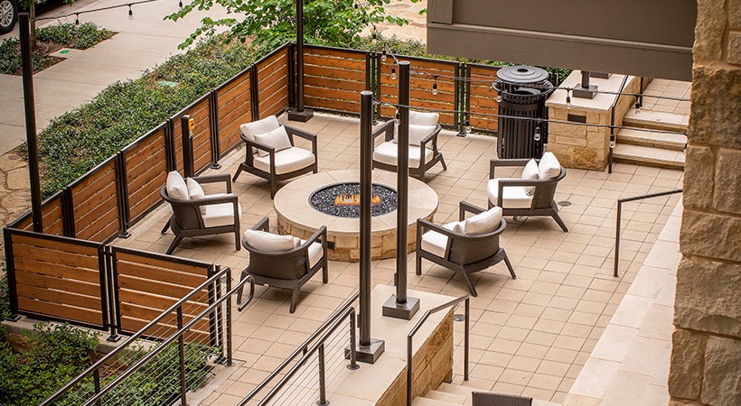 a patio with chairs and a fire pit at The Ash at  Branch