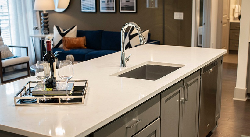 a kitchen with a white counter top and sink at The Ash at  Branch
